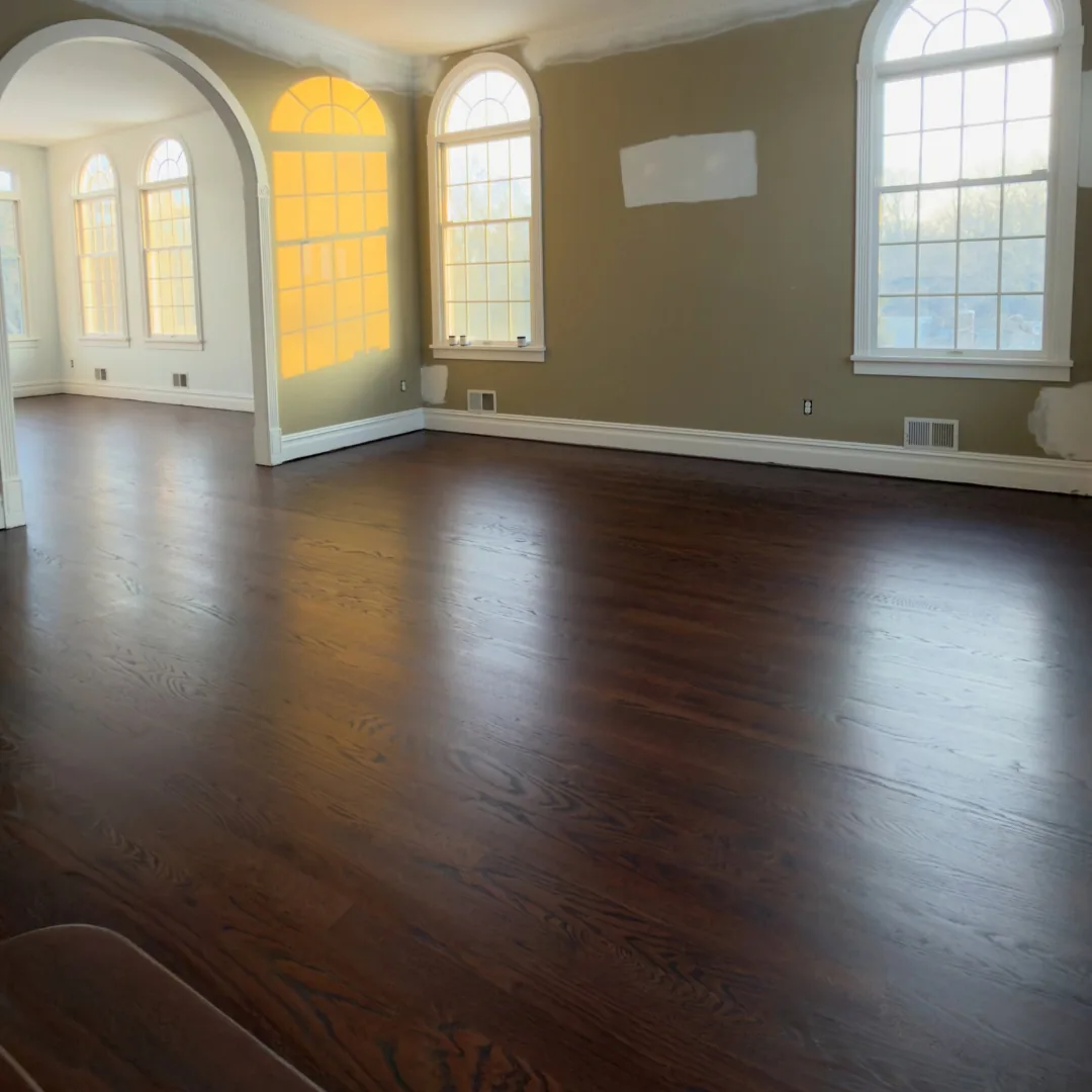 Dark hardwood floor installation in living room.