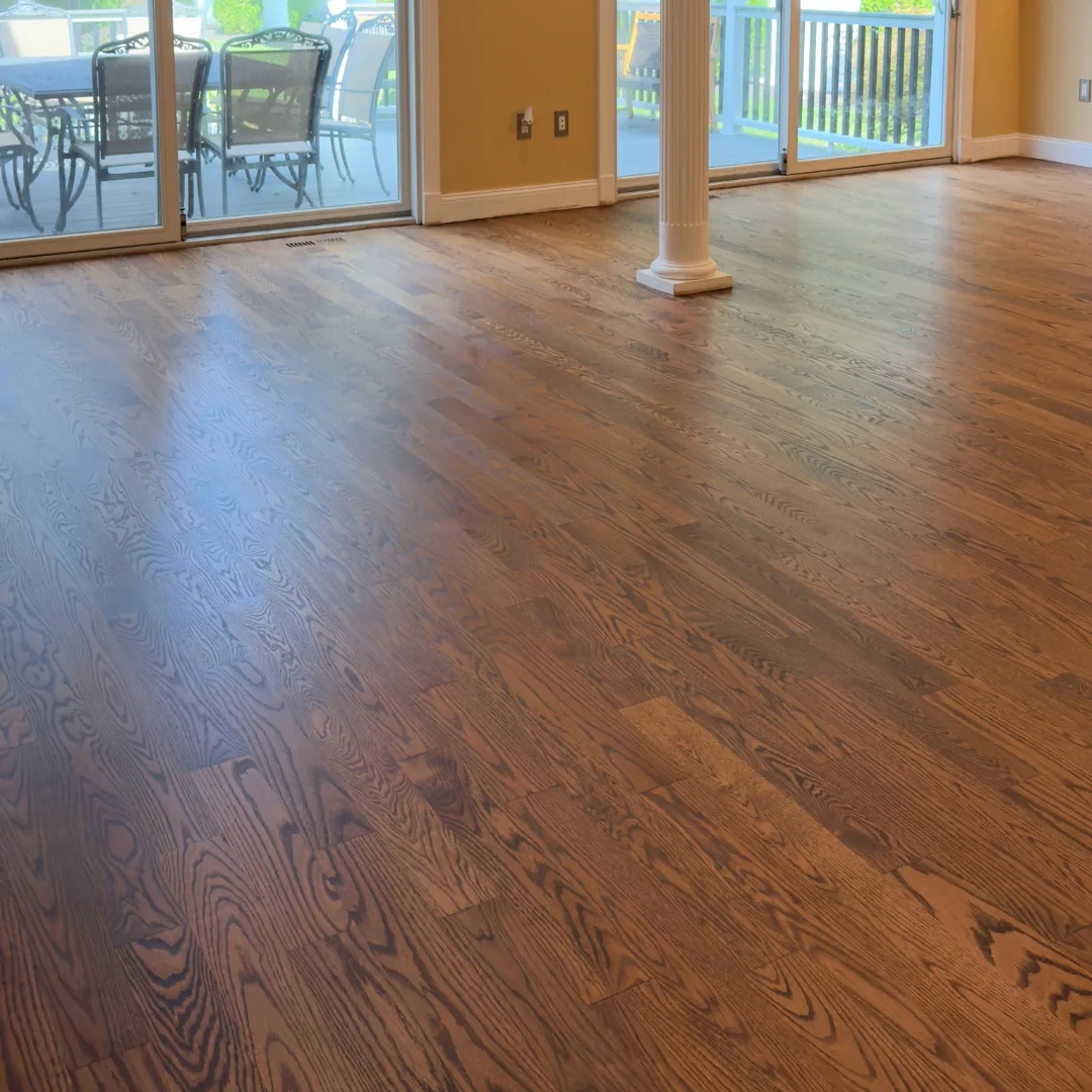 Newly installed dark hardwood flooring in home.